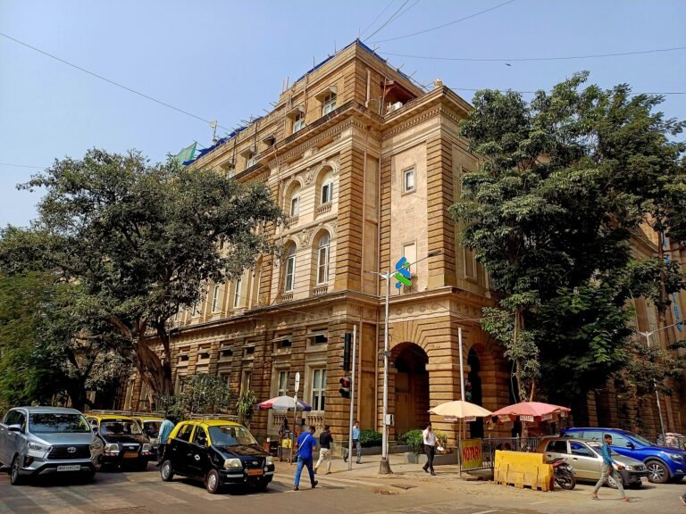 Corner facade of Standard Chartered Bank Building, Mumbai - the financial institution issuing the commodity price forecasts