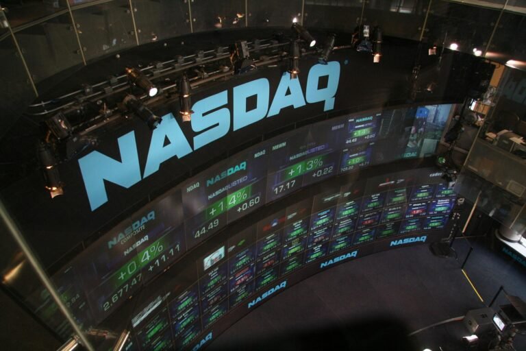 NASDAQ stock market display showing market data and ticker information